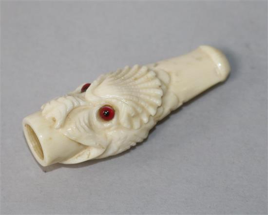 A late Victorian / Edwardian ivory cheroot holder carved as a grotesque fish head with inset eyes, 6cm